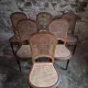 Set of 6 antique Louis XVI style dining chairs with caning.