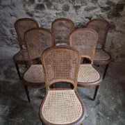 Set of 6 antique Louis XVI style dining chairs with caning.
