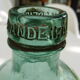 Charming bottle bottle brand BANDEIRA in vintage bluish green glass