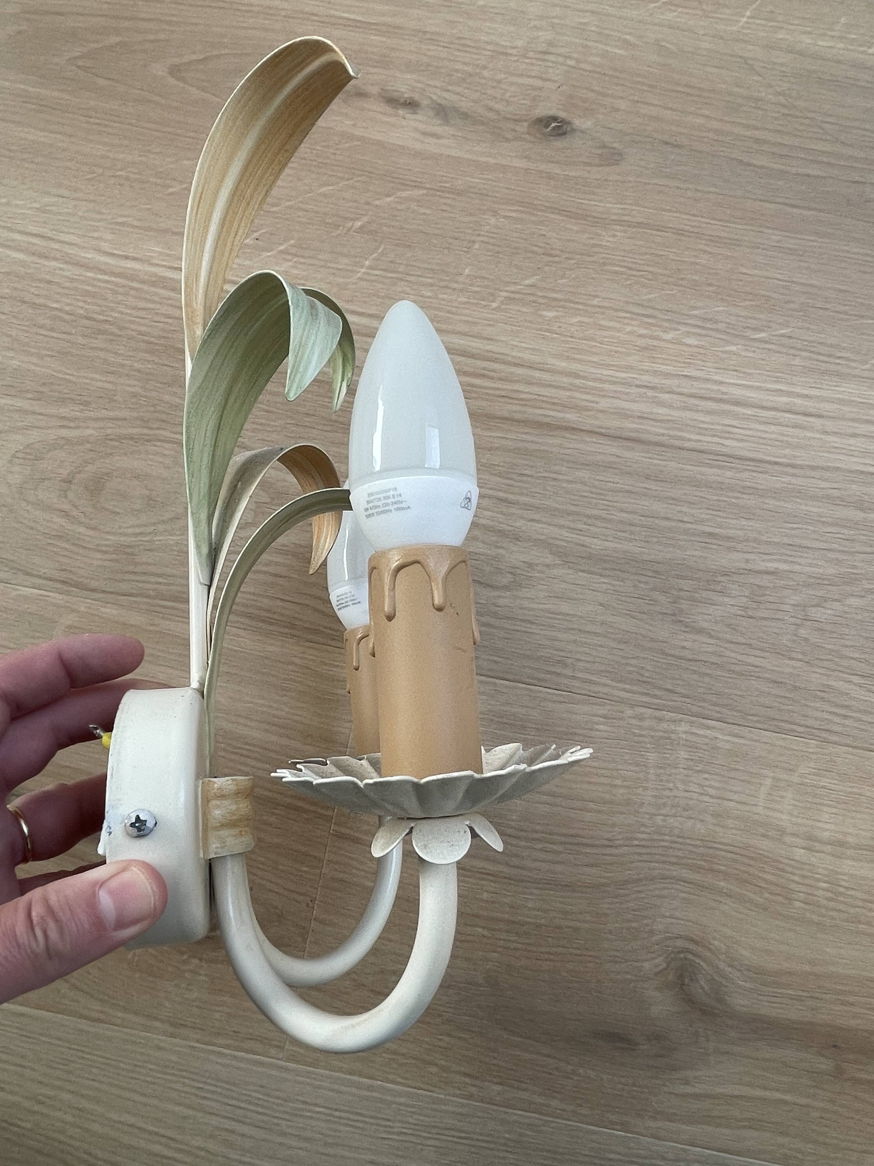 Vintage wrought iron wall sconce in the shape of a flower/leaf