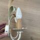 Vintage wrought iron wall sconce in the shape of a flower/leaf