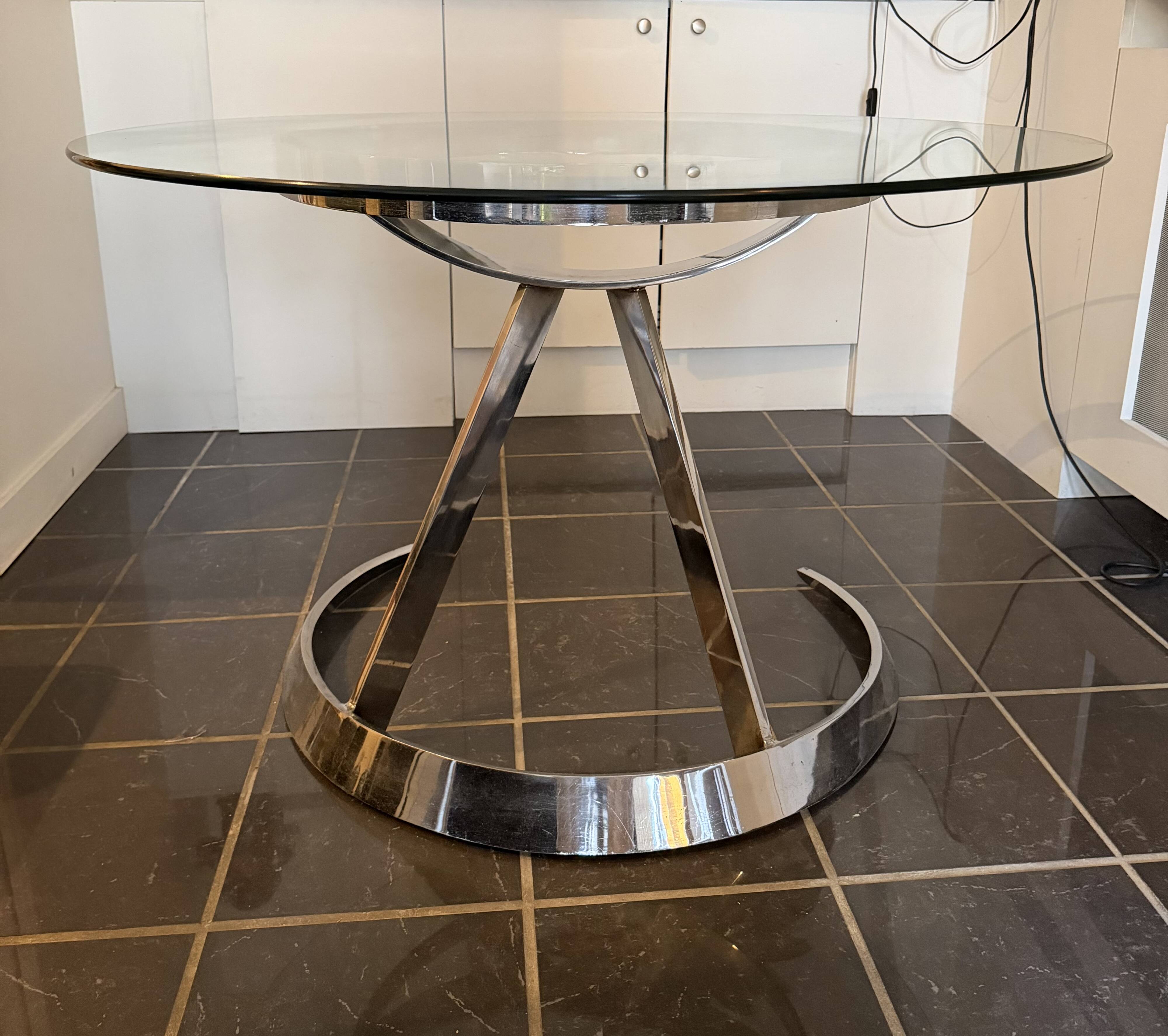 Large round table attributed to Boris Tabacoff, glass and chrome steel, year
