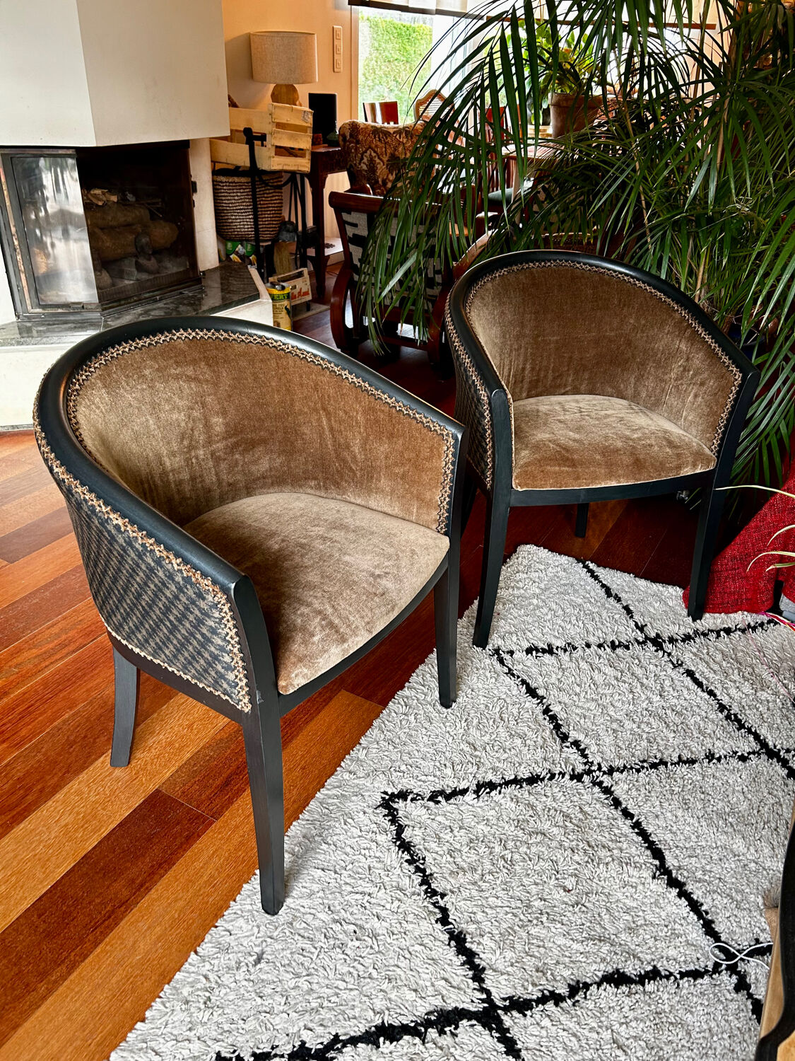Pair of Art Deco barrel chairs in black and bronze