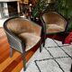 Pair of Art Deco barrel chairs in black and bronze
