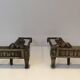 Paire de chenets d'époque Empire en bronze représentant des lions allongés