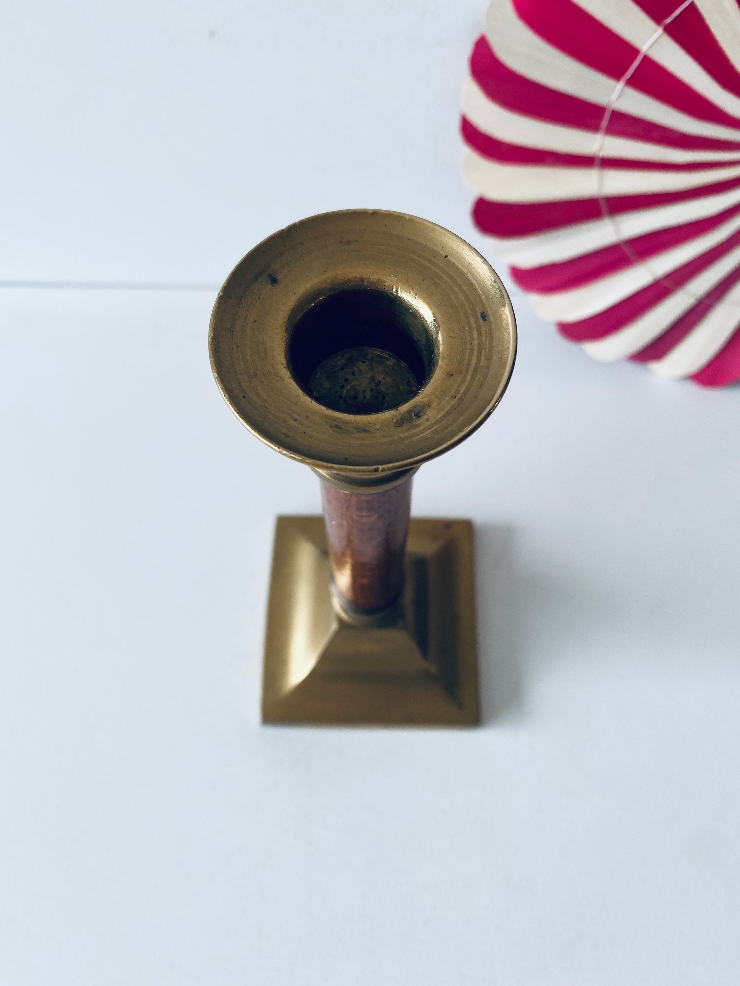 Old candle holder in brass and wood