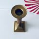 Old candle holder in brass and wood
