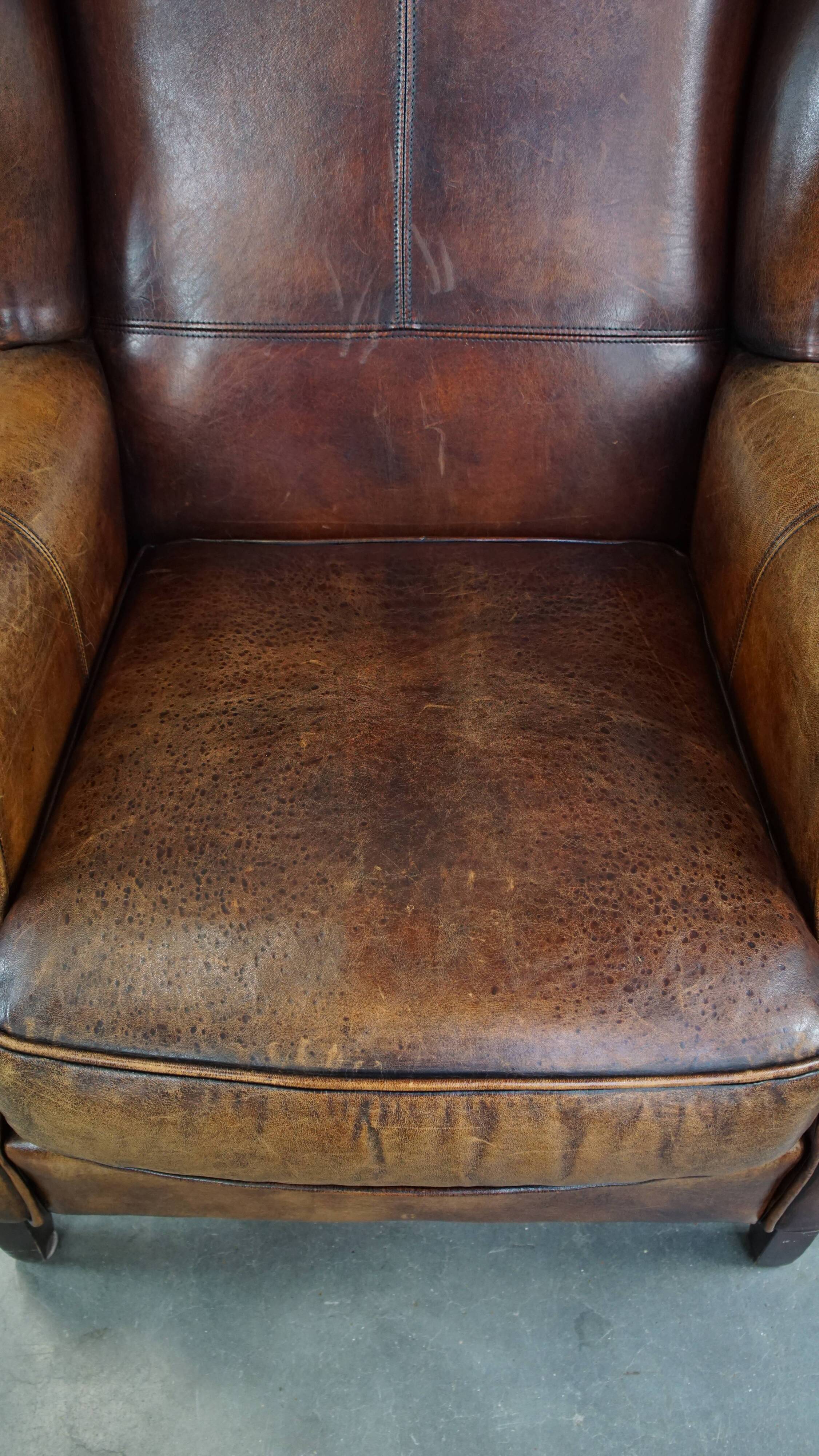 Fauteuil à oreilles en cuir de mouton