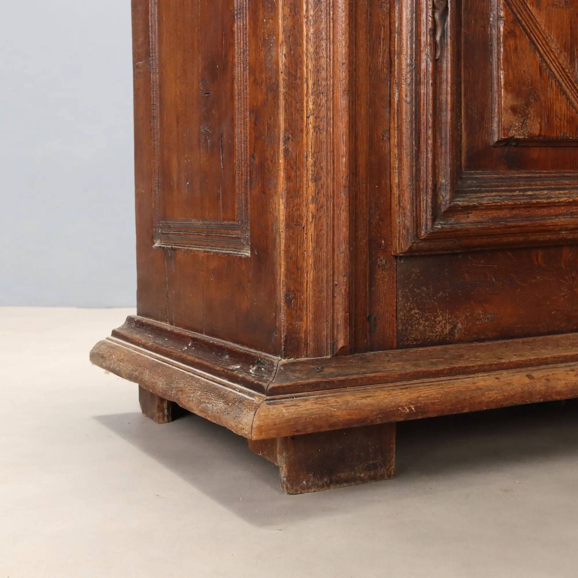 Antique baroque wardrobe in oak with safe, Italy, late 19th century.