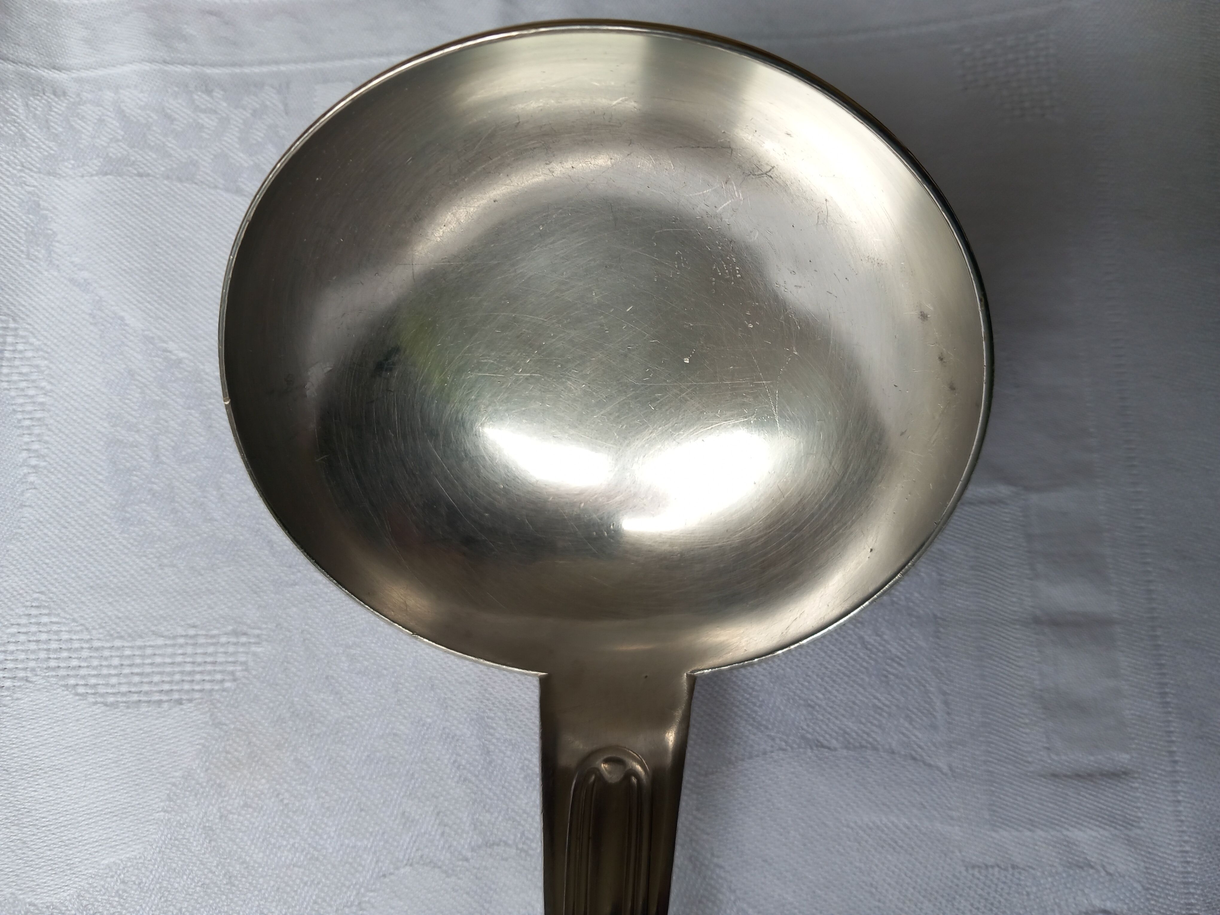 Silver metal ladle