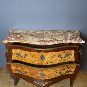 Louis XV style commode with floral marquetry decoration.