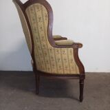 Fauteuil bergère médaillon Louis XVI en noyer tissus en petit point de croix