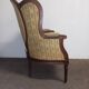Fauteuil bergère médaillon Louis XVI en noyer tissus en petit point de croix