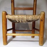 Old child chair in wood and straw