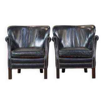 2 fauteuils en cuir noir