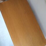 1970s low furniture in wood and metal with sliding doors.