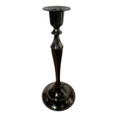 Varnished black metal candlestick