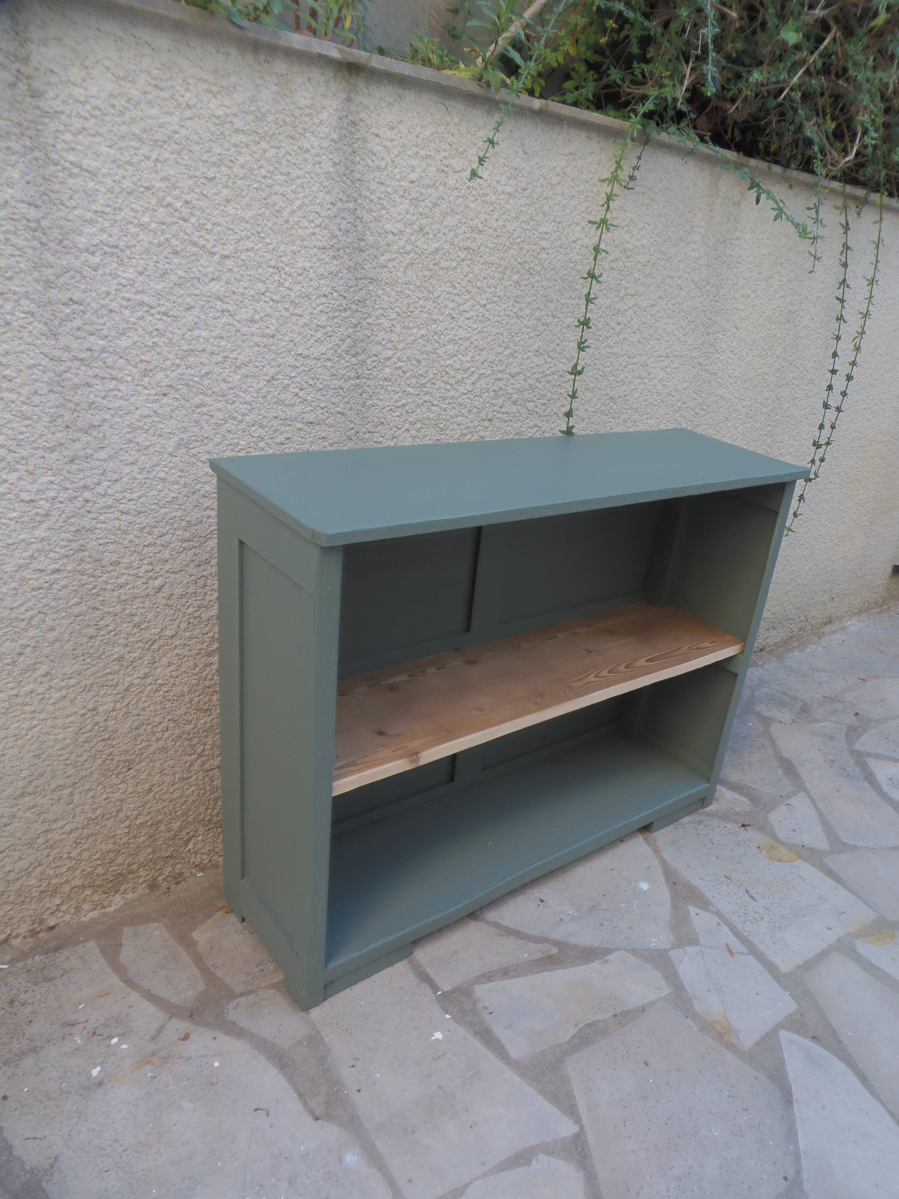 Vintage workshop furniture transformed into a re-enchanted bookshelf in smoky green.
