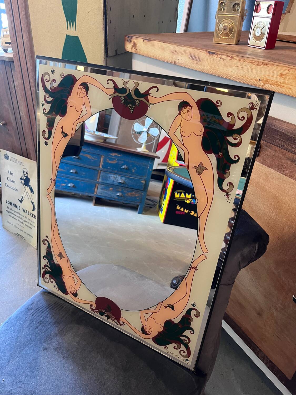 Art Deco style glass mirror, decorated upside down with nude women, signed
