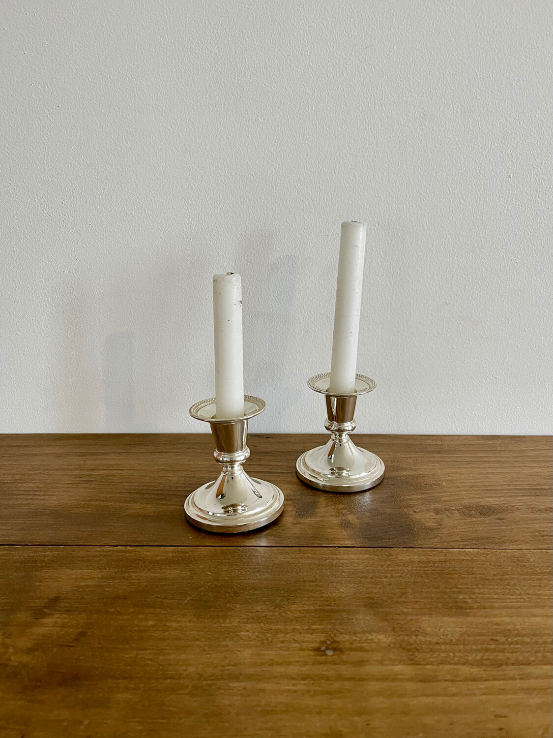 Pair of silver metal candle holders