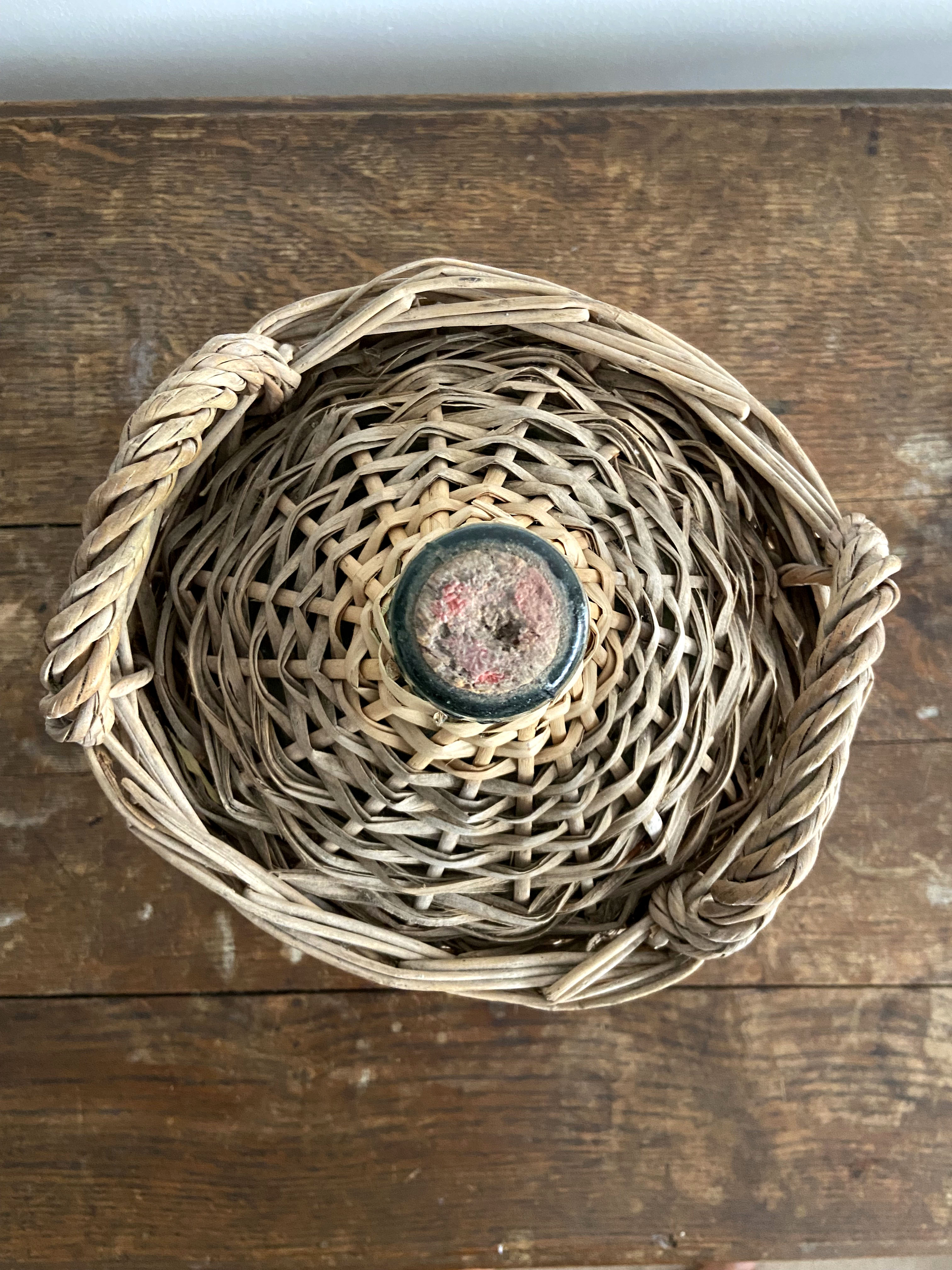 Demijohn surrounded by wicker