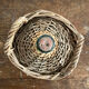 Demijohn surrounded by wicker