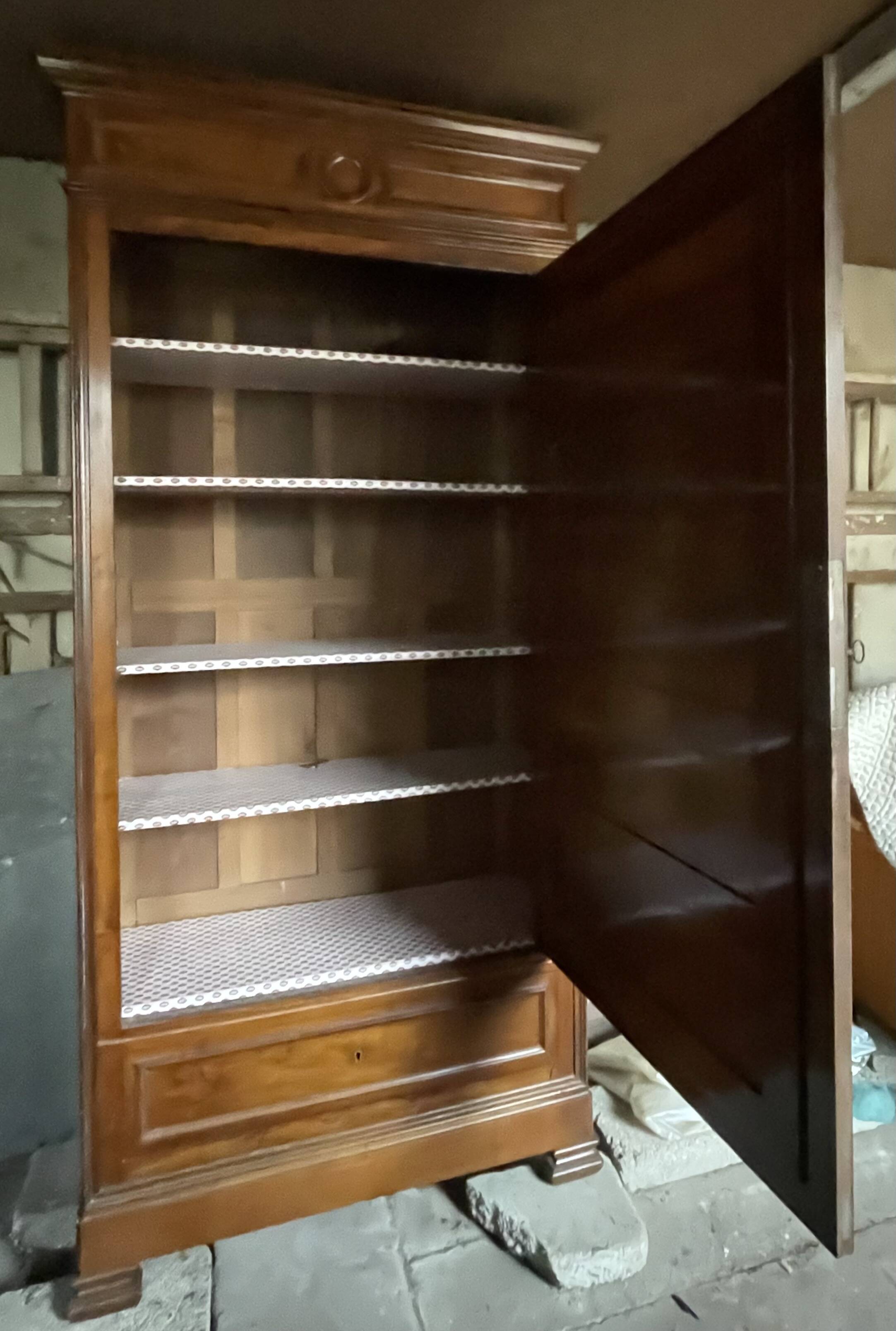 Antique wardrobe with a mirror door.