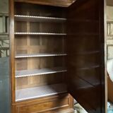 Antique wardrobe with a mirror door.