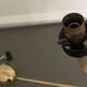 Lustre with 5 branches from the 1960s - 1970s in solid brass and black metal.