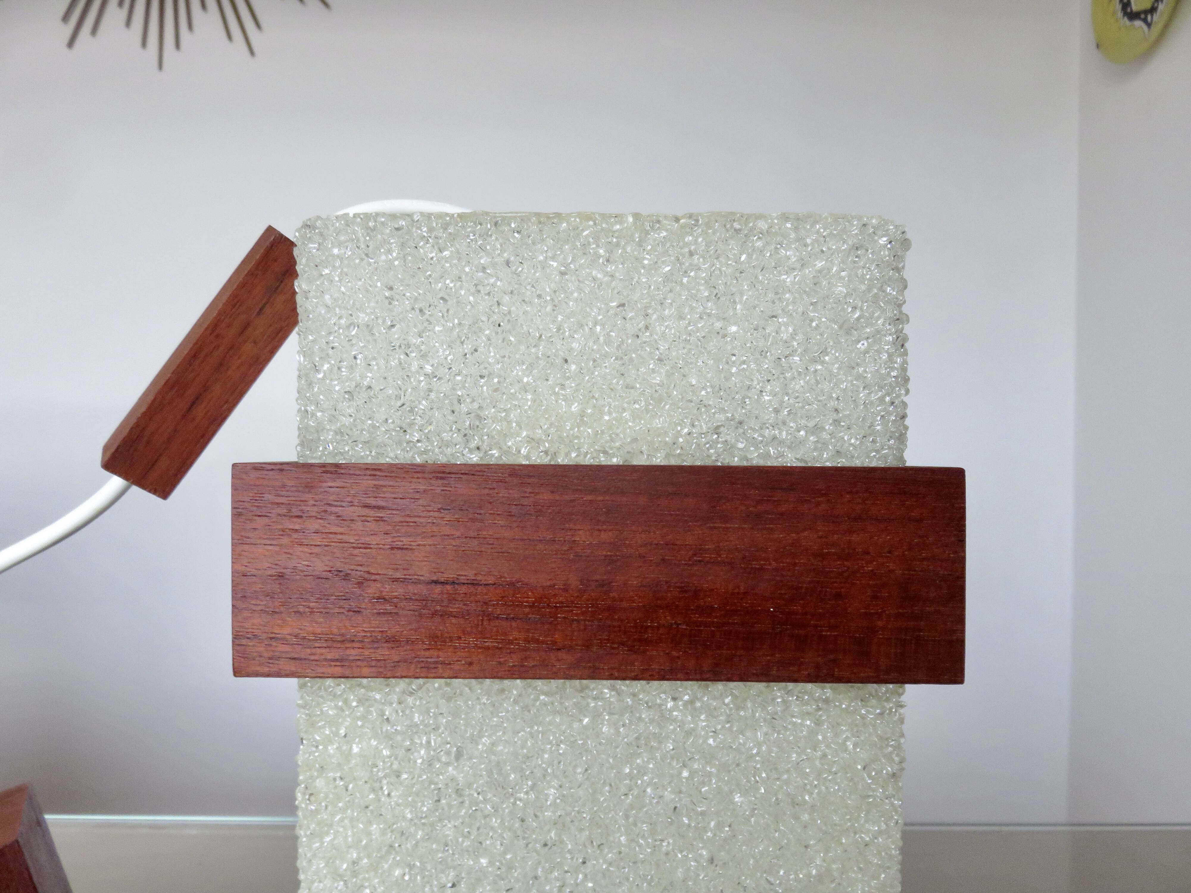 Pair of Scandinavian pendant lights in teak and perspex, 1970s.