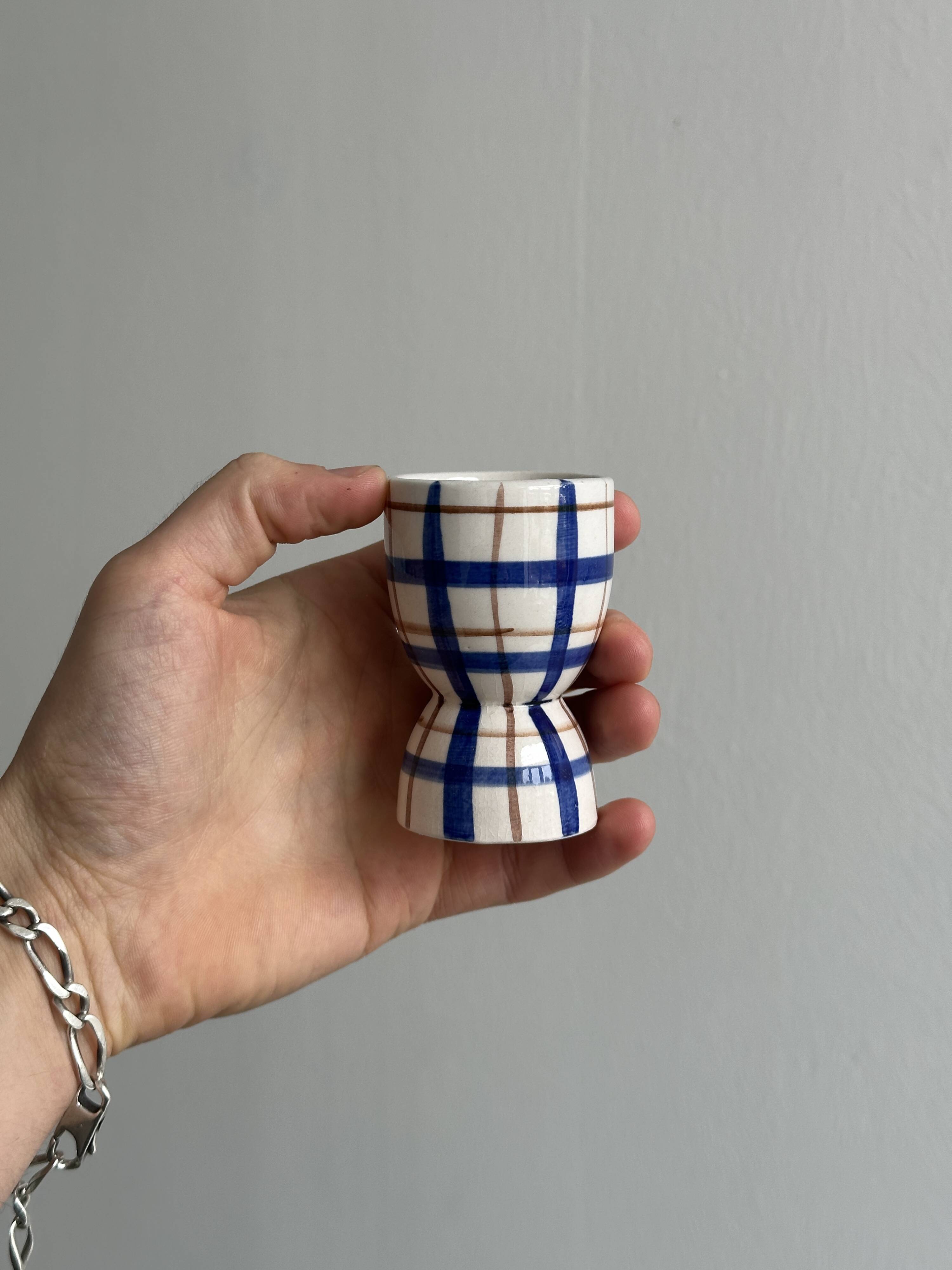 Ceramic egg cup, blue and beige checkered pattern