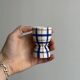 Ceramic egg cup, blue and beige checkered pattern