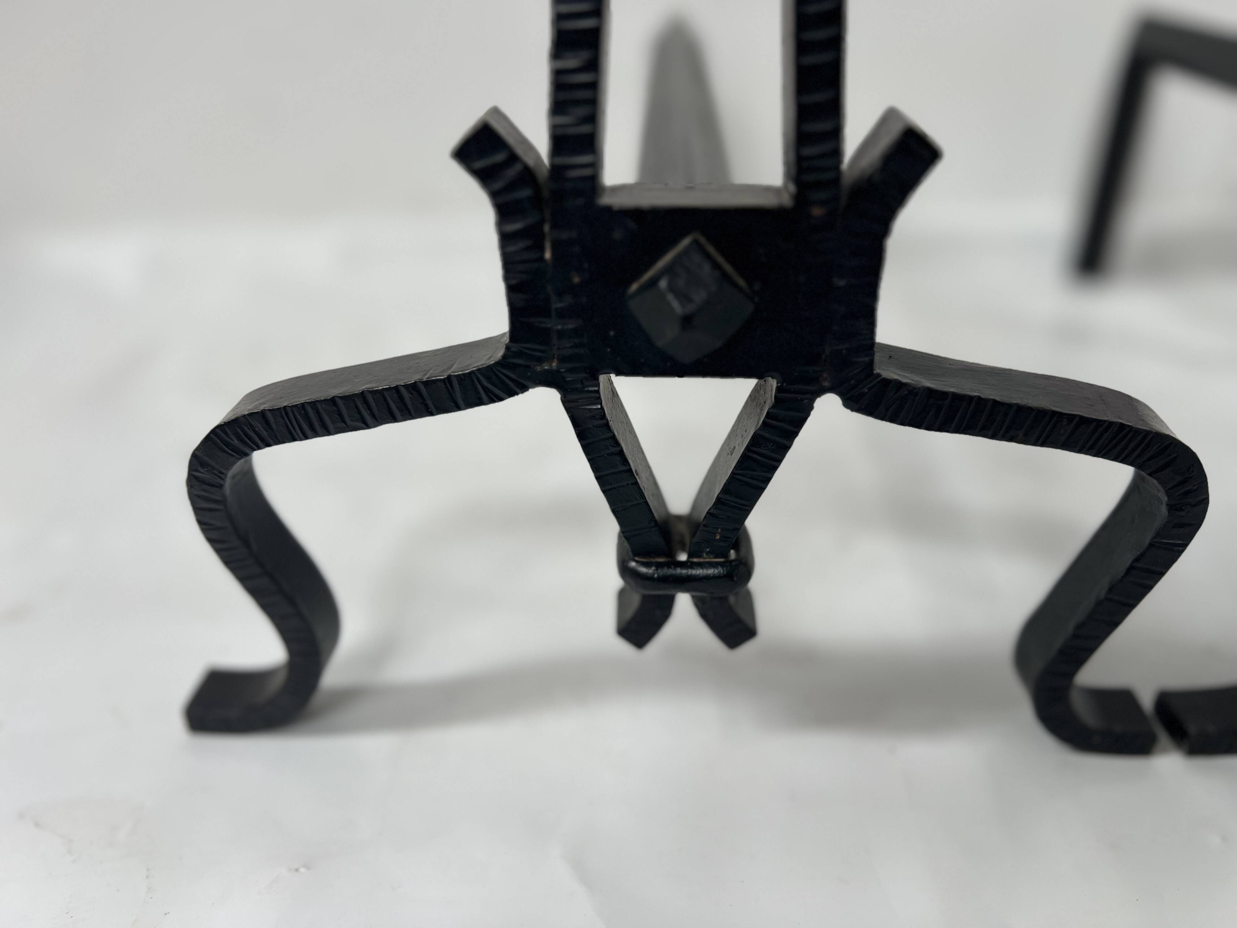 Pair of wrought and hammered iron bedside tables, 20th century