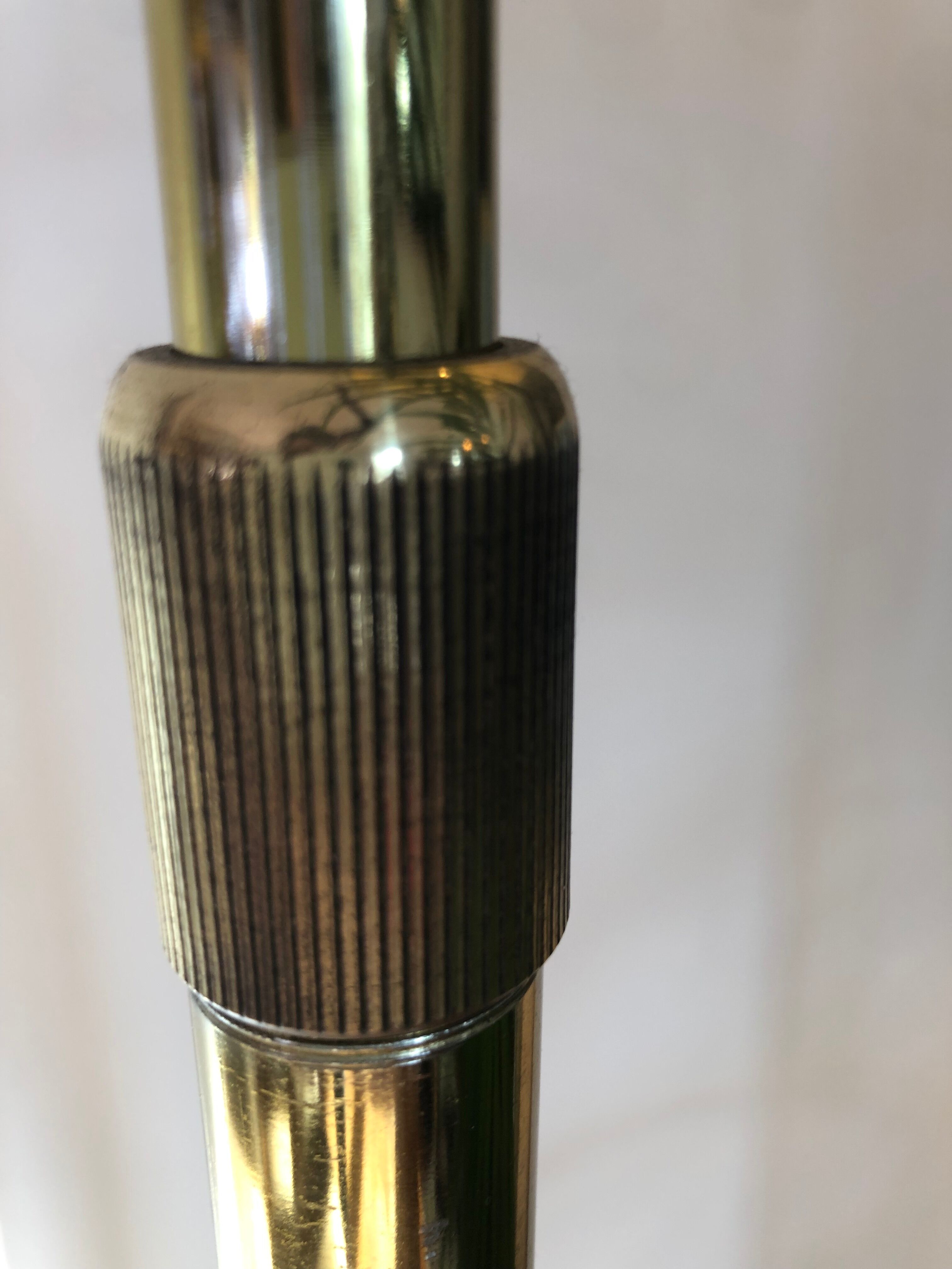 Arc floor lamp by Harvey Guzzini brass model