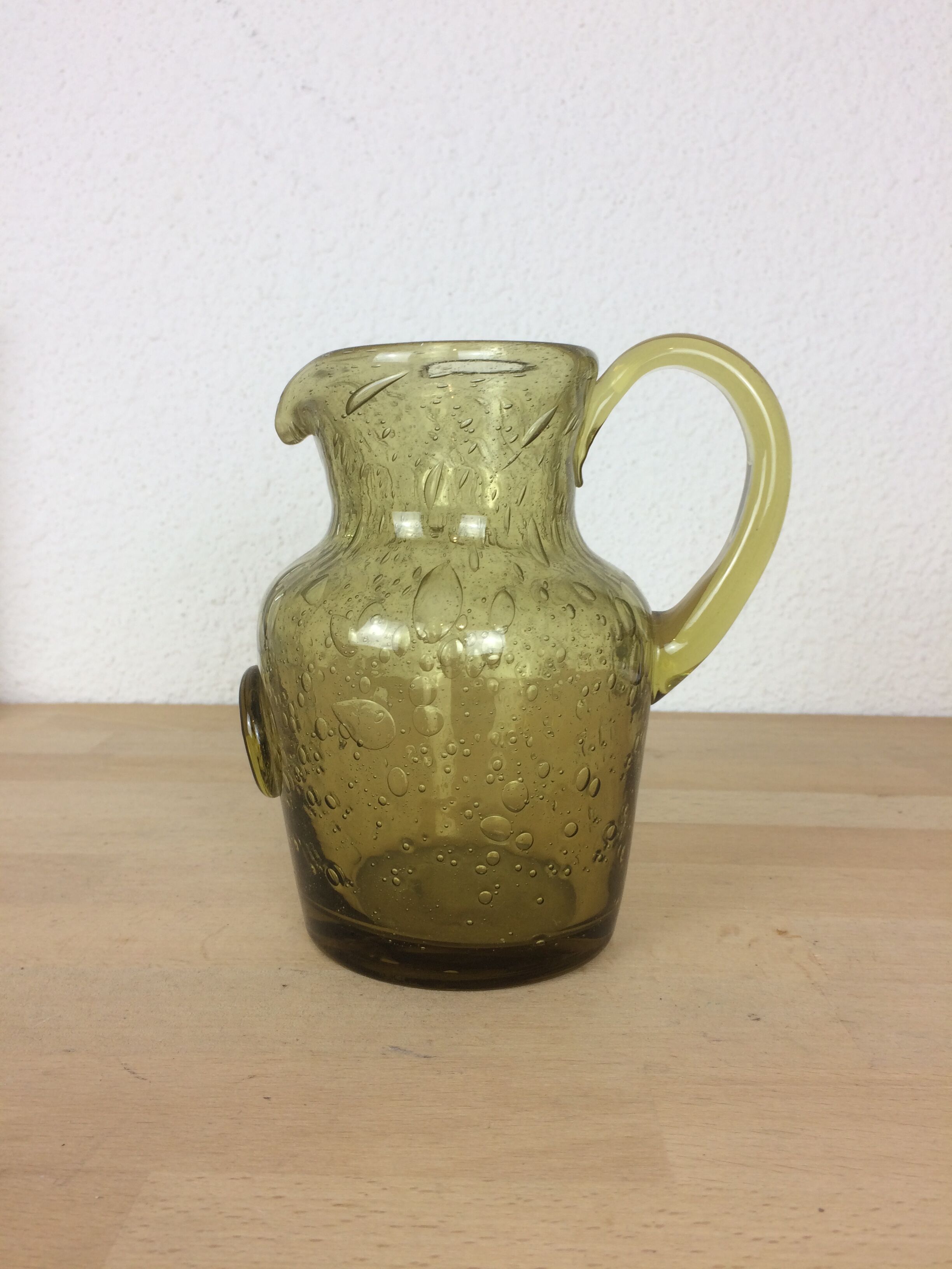 Green bubbled glass pitcher