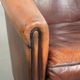 Vintage sheepskin club armchair finished with black piping