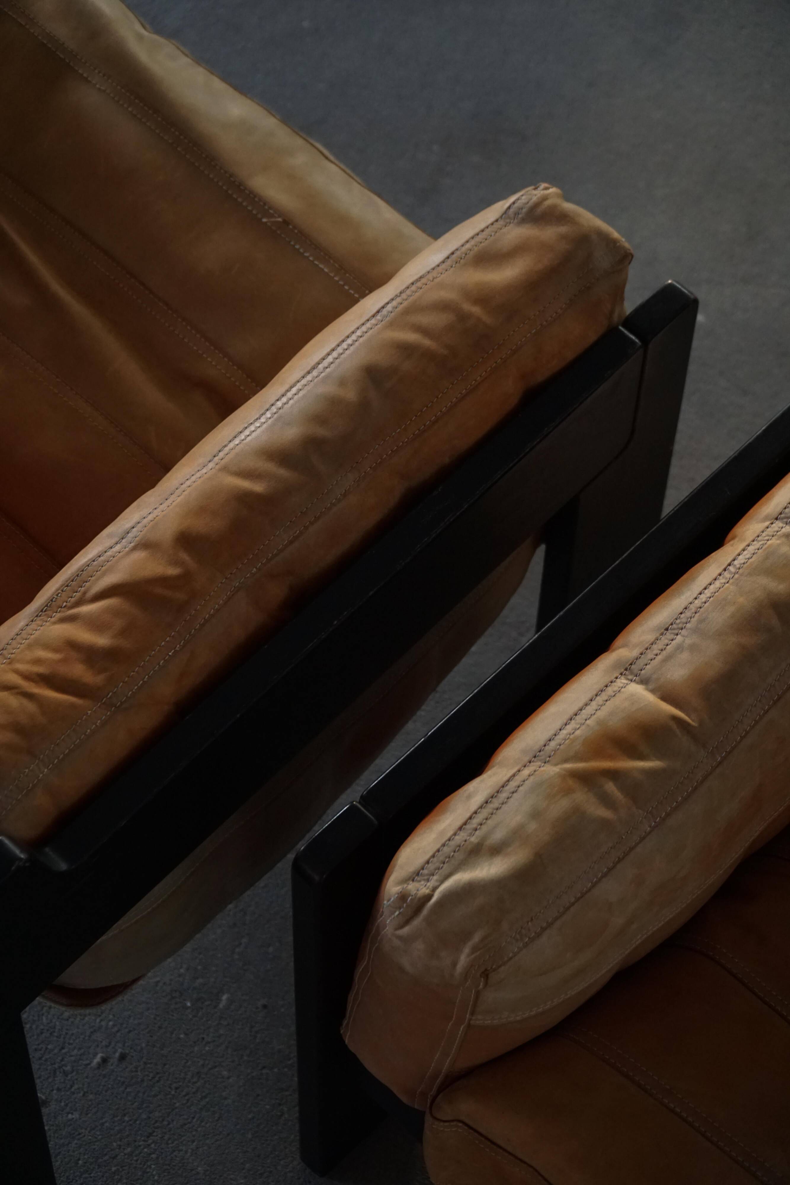 Pair of wooden and leather armchairs by Rud Thygesen & Johnny Sørensen, 1970s.