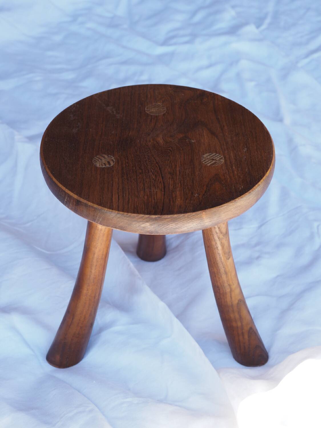 Old rustic milking stool