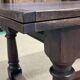 English monastery table with extensions from the late 19th century in elm and oak.