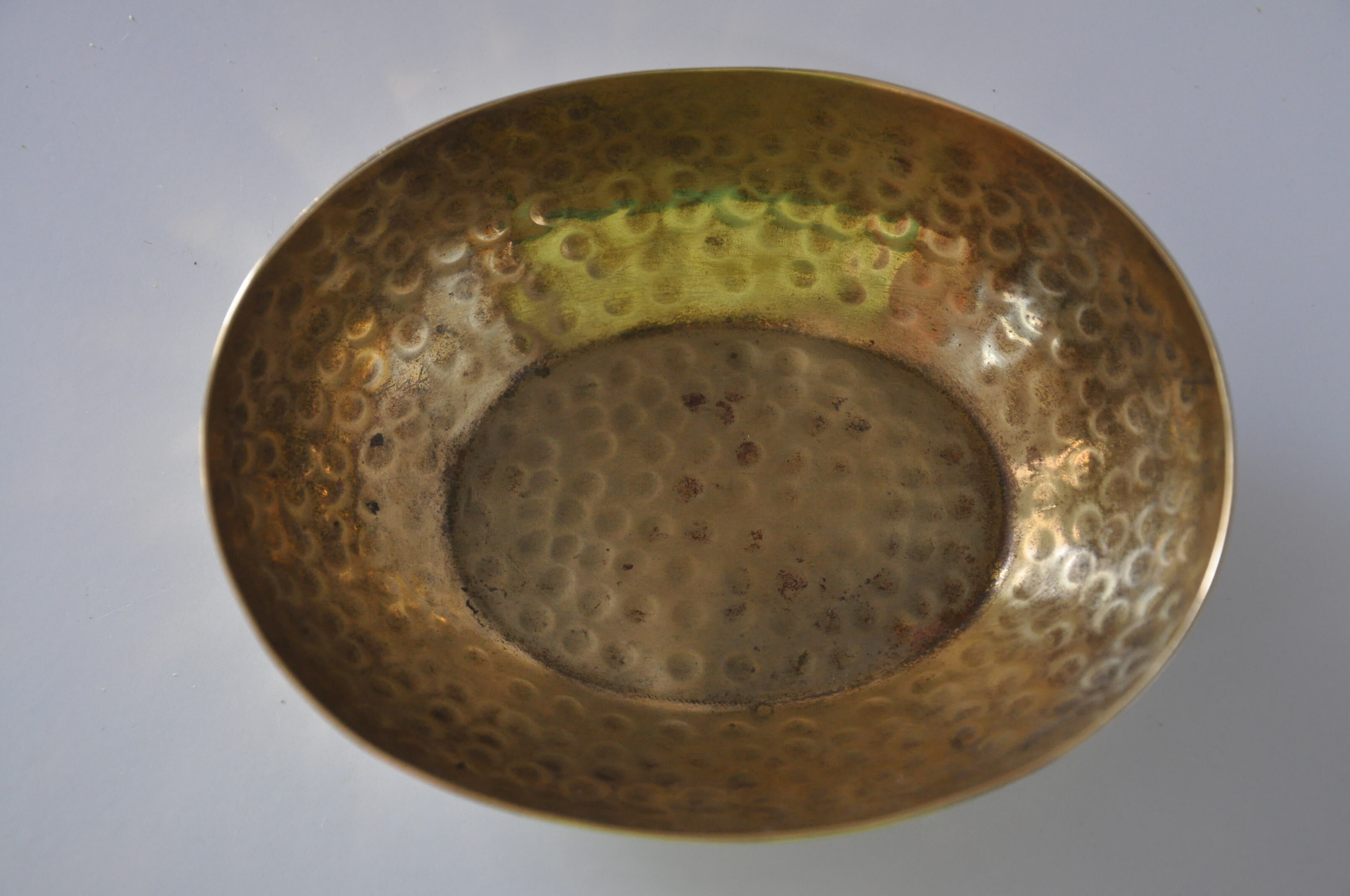 Empty hammered brass pocket