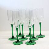 8 large green stem champagne flutes in very good condition.