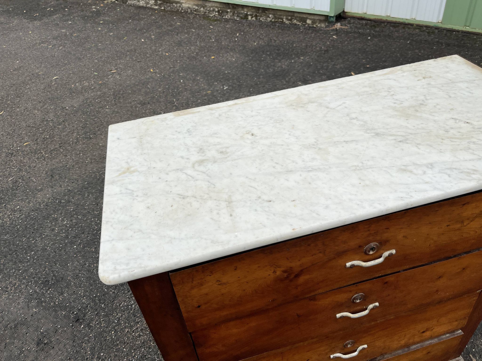 Antique 19th-century wooden chest of drawers with a marble top