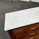 Antique 19th-century wooden chest of drawers with a marble top
