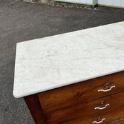 Antique 19th-century wooden chest of drawers with a marble top