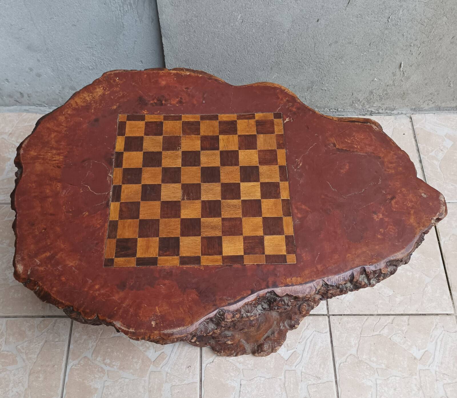 Brutalist chessboard coffee table made from tree stump.