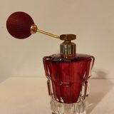 Red crystal perfume spray and red pump.