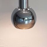 Extendable chrome ball pendant light.