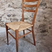 Set of 4 mid-century Italian dining chairs with woven seats, circa 1950–1970.