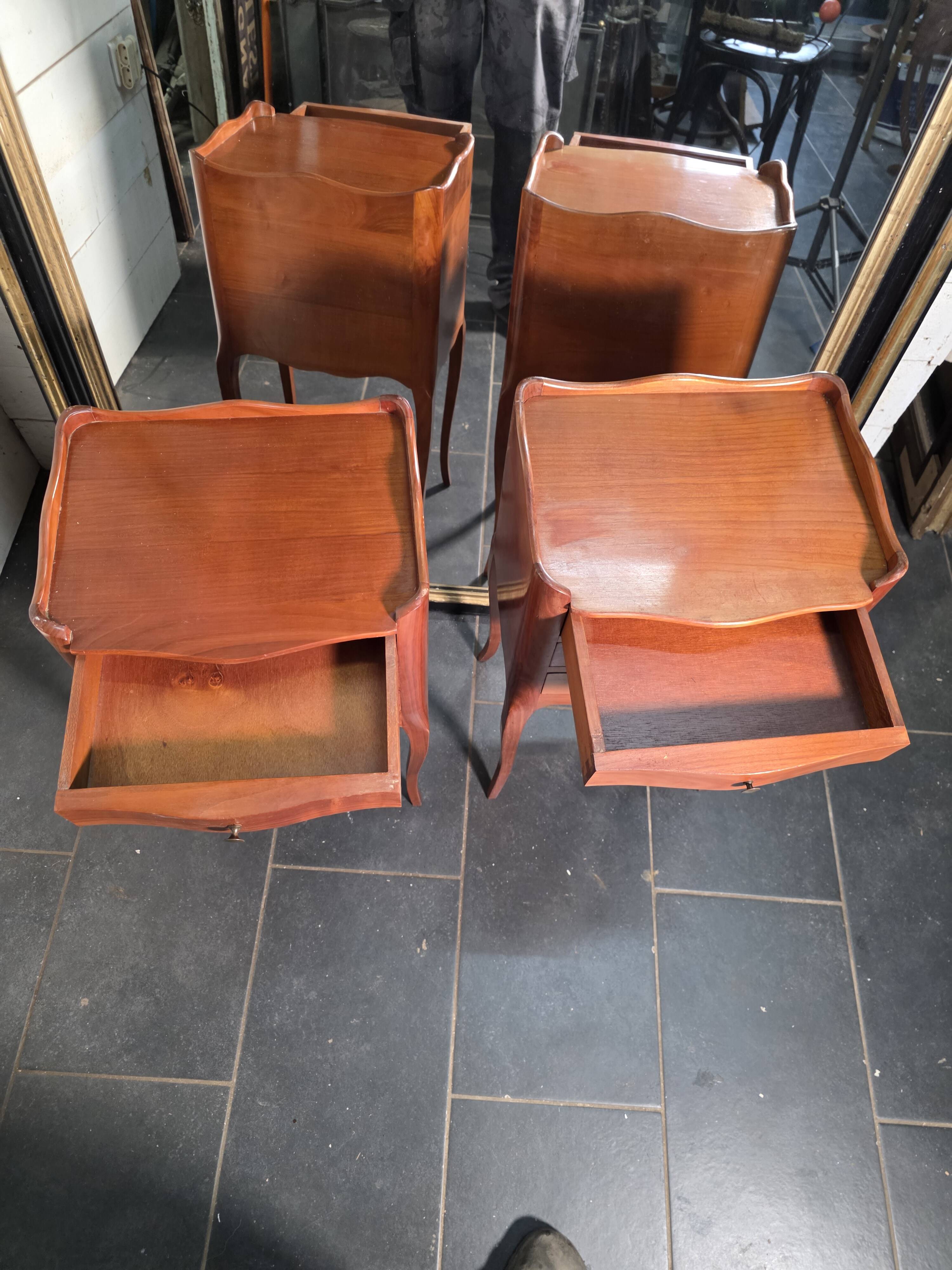 Pair of Louis XV style bedside tables in cherry wood.
