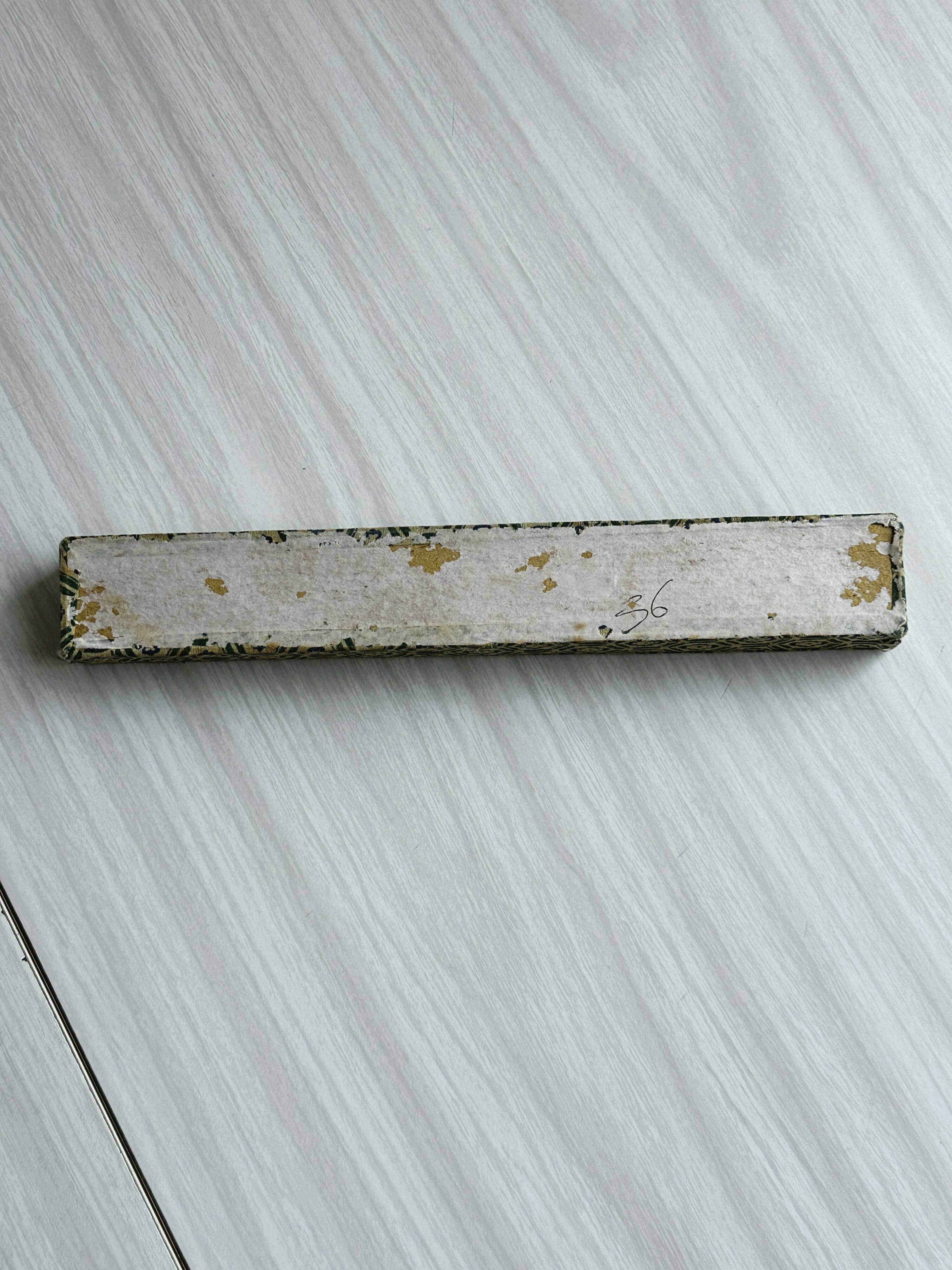 Blue chopsticks decorated with floral motifs.